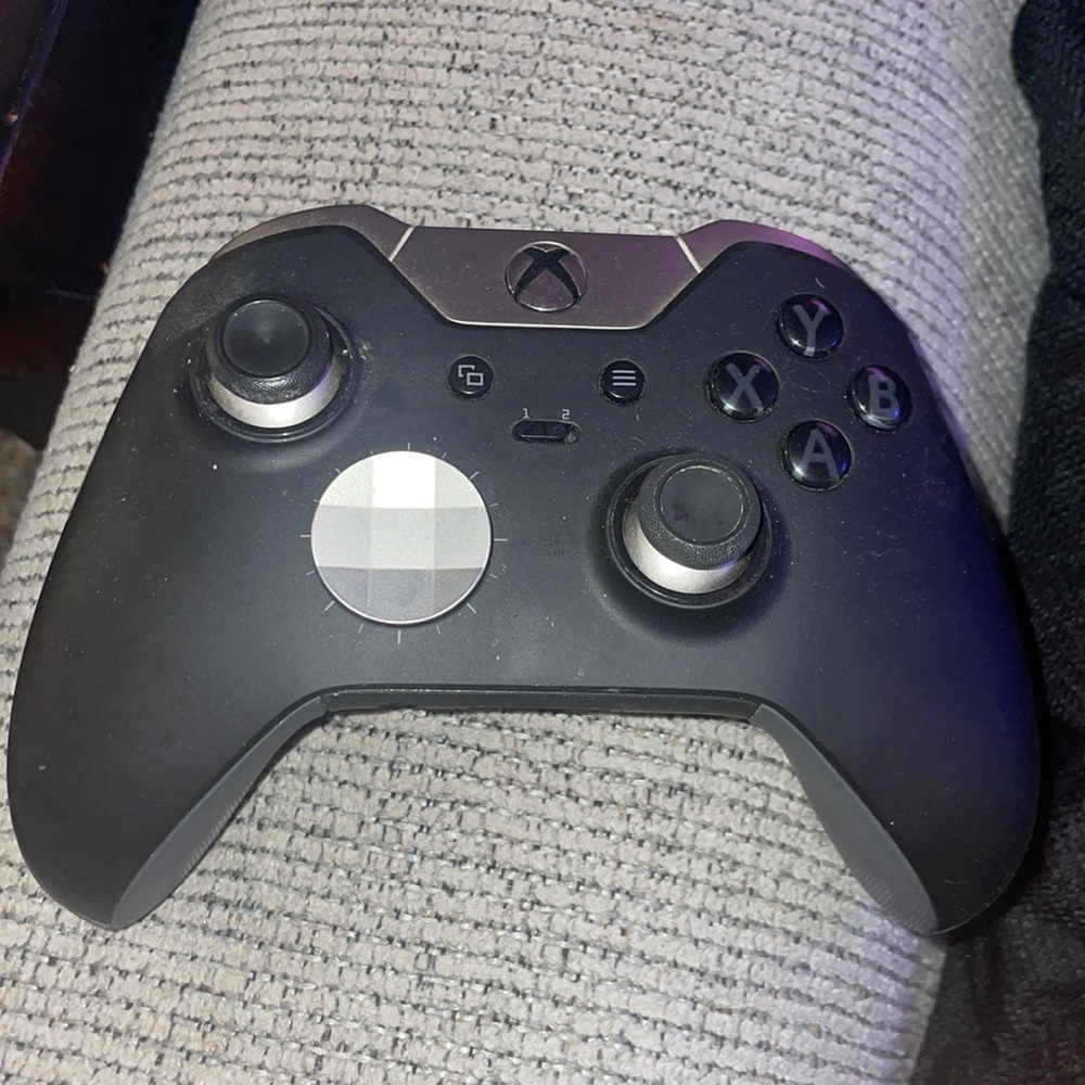 Xbox Elite Controller Series 1 with rechargeable battery pack.